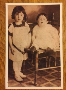 A photograph of the author's Aunt Ruth Scher as a baby (sitting on the chair), next to her Aunt Signa Scher.  