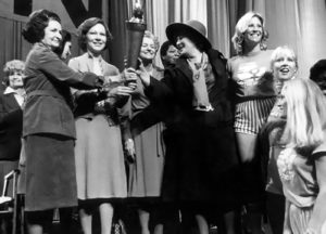 Bella Abzug passes the Olympic Torch to First Ladies at the National Women's Conference, Houston, Texas